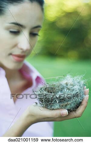 Woman holding nest View Large Photo Image Stock Photo - Woman holding nest. Fotosearch