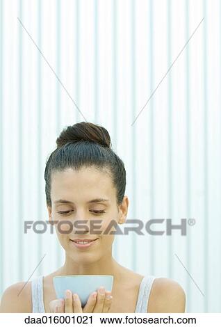 Woman holding up bowl View Large Photo Image Stock Image - Woman holding up bowl. Fotosearch