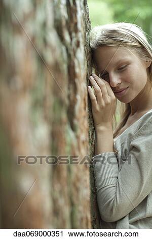 Woman hugging tree, portrait View Large Photo Image Stock Image - Woman hugging tree, portrait. Fotosearch