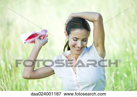 Woman in field, smiling, head and shoulders View Large Photo Image Stock Photo - Woman in field, smiling, head and shoulders. Fotosearch