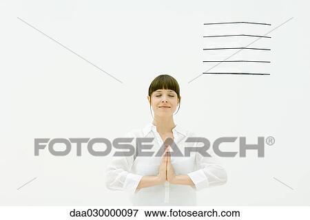 Woman in prayer position, smiling, eyes closed View Large Photo Image Stock Photo - Woman in prayer position, smiling, eyes closed. Fotosearch