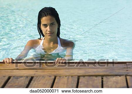 Stock Image - Woman in swimming pool. Fotosearch