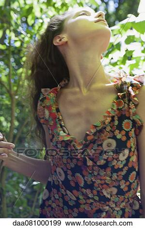 Stock Photo - Woman in woods. Fotosearch