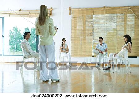 Woman leading group therapy session, rear view View Large Photo Image Stock Image - Woman leading group therapy session, rear view. Fotosearch
