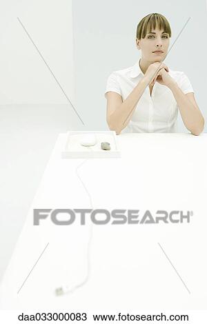 Woman leaning on elbows, computer mouse nearby in rock garden, looking at camera View Large Photo Image Stock Image - Woman leaning on elbows, computer mouse nearby in rock garden, looking at camera. Fotosearch