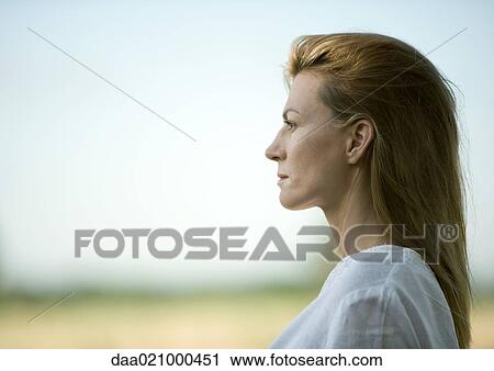 Woman outdoors, head and shoulders, profile View Large Photo Image Stock Image - Woman outdoors, head and shoulders, profile. Fotosearch