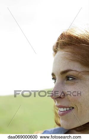 Woman outdoors, looking away, portrait View Large Photo Image Stock Image - Woman outdoors, looking away, portrait. Fotosearch