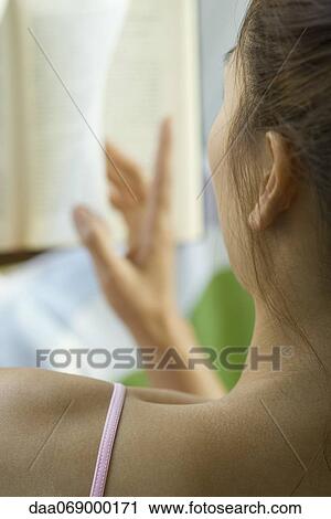 Woman reading book, rear view View Large Photo Image Stock Image - Woman reading book, rear view. Fotosearch