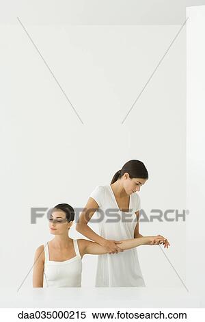 Stock Photography - Woman receiving arm massage. Fotosearch