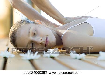 Woman receiving back massage View Large Photo Image Stock Image - Woman receiving back massage. Fotosearch