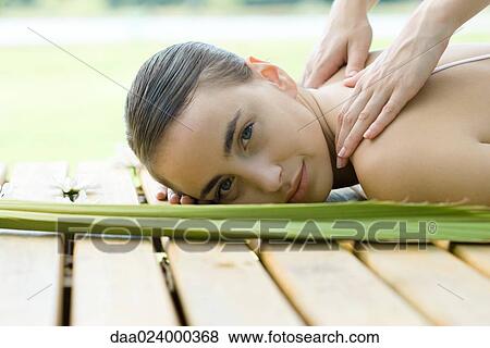 Woman receiving back massage View Large Photo Image Stock Photo - Woman receiving back massage. Fotosearch