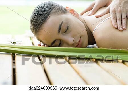 Woman receiving back massage View Large Photo Image Stock Photo - Woman receiving back massage. Fotosearch