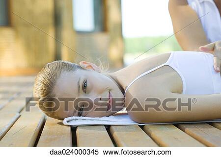 Woman receiving back massage View Large Photo Image Stock Photography - Woman receiving back massage. Fotosearch