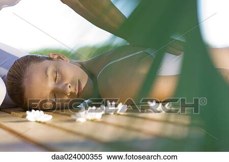 Woman receiving back massage View Large Photo Image Stock Photography - Woman receiving back massage. Fotosearch