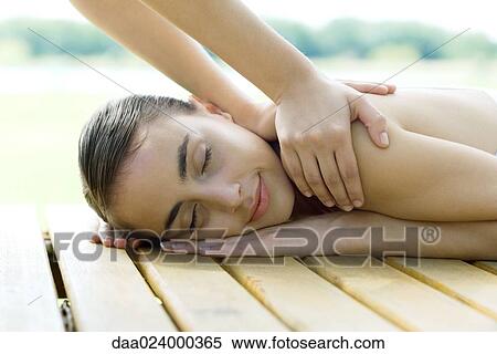 Woman receiving back massage View Large Photo Image Stock Photography - Woman receiving back massage. Fotosearch
