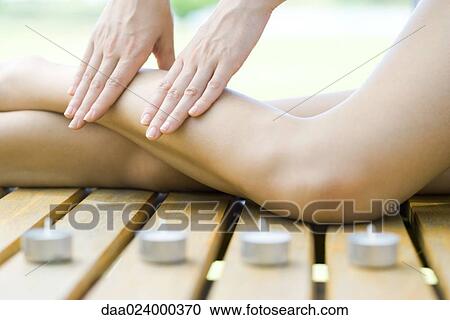 Woman receiving leg massage View Large Photo Image Stock Image - Woman receiving leg massage. Fotosearch