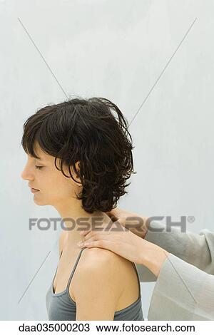 Woman receiving lower neck massage View Large Photo Image Stock Image - Woman receiving lower neck massage. Fotosearch
