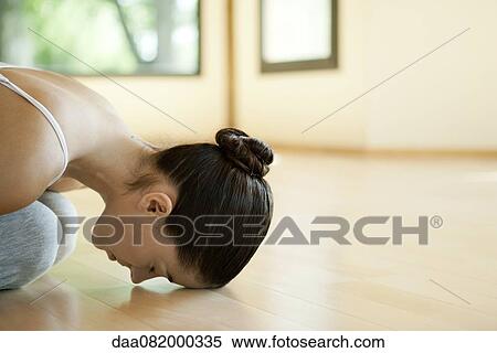 Woman resting in child's pose View Large Photo Image Stock Photography - Woman resting in child's pose. Fotosearch