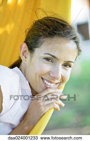 Woman resting in hammock, close-up View Large Photo Image Stock Image - Woman resting in hammock, close-up. Fotosearch