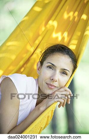 Woman resting in hammock View Large Photo Image Stock Image - Woman resting in hammock. Fotosearch