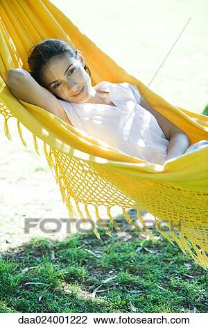 Woman resting in hammock, waist up View Large Photo Image Stock Image - Woman resting in hammock, waist up. Fotosearch