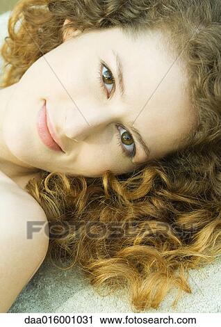 Woman smiling at camera, close-up View Large Photo Image Stock Image - Woman smiling at camera, close-up. Fotosearch
