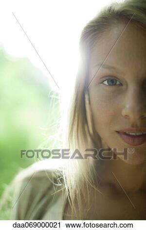 Woman smiling at camera, cropped portrait View Large Photo Image Stock Image - Woman smiling at camera, cropped portrait. Fotosearch