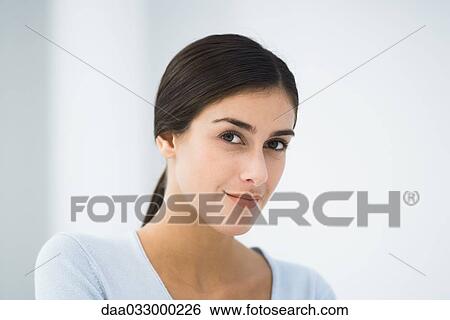 Woman smiling at camera, portrait View Large Photo Image Stock Photograph - Woman smiling at camera, portrait. Fotosearch