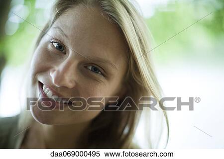 Woman smiling at camera, portrait View Large Photo Image Stock Photography - Woman smiling at camera, portrait. Fotosearch