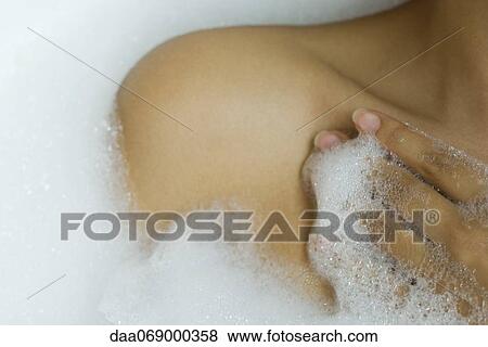 Woman taking bubble bath, cropped View Large Photo Image Stock Photo - Woman taking bubble bath, cropped. Fotosearch