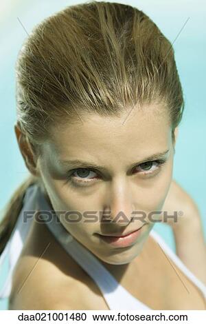 Stock Image - Woman wearing halter bathing suit, head and shoulders, portrait, high angle view. Fotosearch