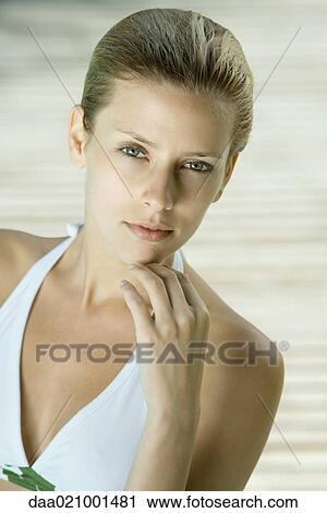 Stock Image - Woman wearing halter bathing suit, head and shoulders, portrait, high angle view. Fotosearch