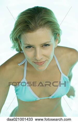 Woman wearing swimsuit, smiling, portrait, waist up View Large Photo Image Stock Image - Woman wearing swimsuit, smiling, portrait, waist up. Fotosearch