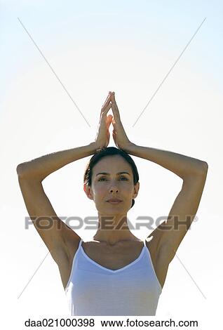 Woman with arms in prayer position View Large Photo Image Stock Photo - Woman with arms in prayer position. Fotosearch