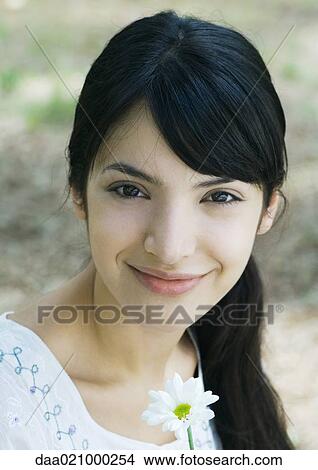 Woman with flower, portrait View Large Photo Image Picture - Woman with flower, portrait. Fotosearch