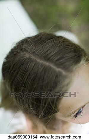 Woman with hair parted, directly above View Large Photo Image Picture - Woman with hair parted, directly above. Fotosearch