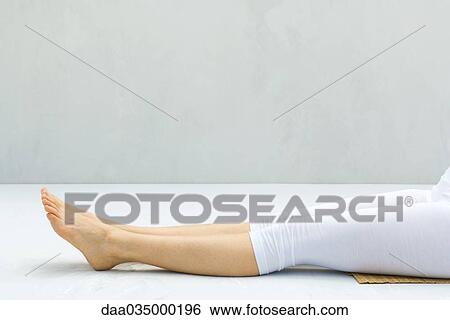 Woman with legs outstretched, barefoot, low section View Large Photo Image Stock Photograph - Woman with legs outstretched, barefoot, low section. Fotosearch