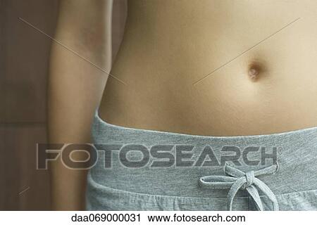 Woman's bare stomach, cropped View Large Photo Image Stock Image - Woman's bare stomach, cropped. Fotosearch