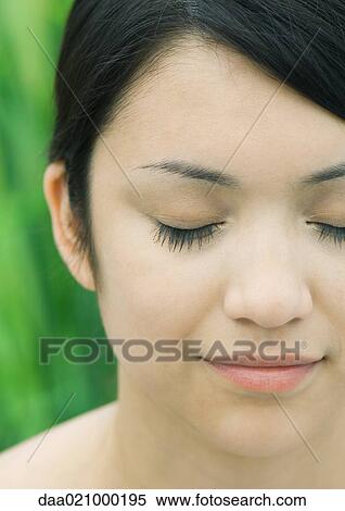 Stock Photography - Woman's face, eyes closed, extreme close-up. Fotosearch