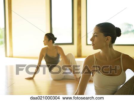 Women doing spinal twists View Large Photo Image Picture - Women doing spinal twists. Fotosearch
