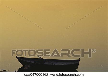 Wooden canoe on water, misty background View Large Photo Image Stock Image - Wooden canoe on water, misty background. Fotosearch