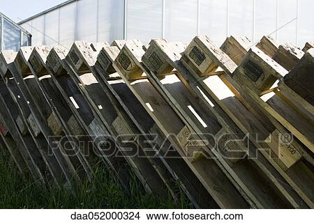 Picture - Wooden pallets leaning one against the other. Fotosearch