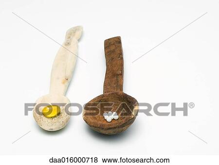 Wooden spoons containing homeopathic and natural medicines View Large Photo Image Stock Photo - Wooden spoons containing homeopathic and natural medicines. Fotosearch