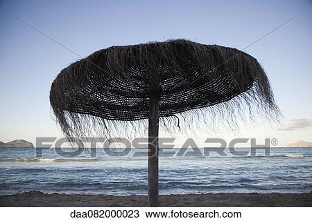 Woven straw beach umbrella View Large Photo Image Stock Image - Woven straw beach umbrella. Fotosearch