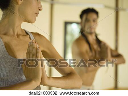Yoga class doing prayer pose View Large Photo Image Stock Image - Yoga class doing prayer pose. Fotosearch