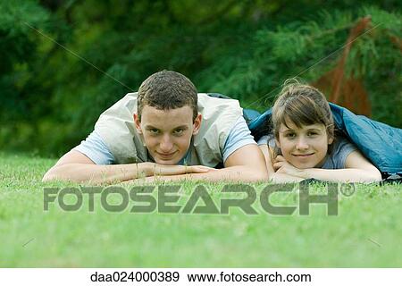Young campers in sleeping bags, smiling at camera View Large Photo Image Stock Photo - Young campers in sleeping bags, smiling at camera. Fotosearch
