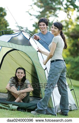 Young campers setting up tent View Large Photo Image Stock Photograph - Young campers setting up tent. Fotosearch