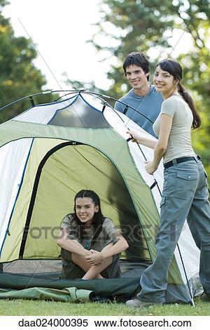 Young campers setting up tent View Large Photo Image Stock Photography - Young campers setting up tent. Fotosearch