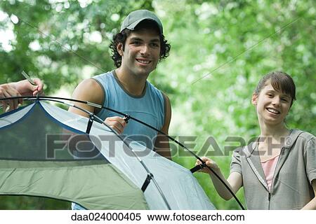 Young campers standing by tent View Large Photo Image Stock Photography - Young campers standing by tent. Fotosearch