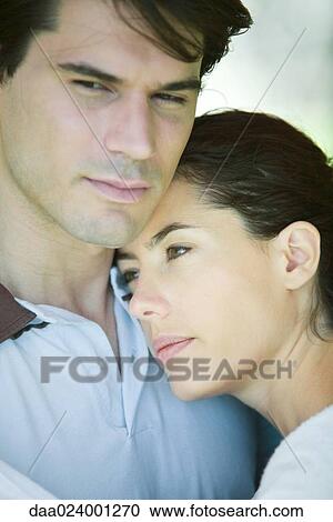 Young couple, woman putting head on man's shoulder, close-up, portrait View Large Photo Image Stock Image - Young couple, woman putting head on man's shoulder, close-up, portrait. Fotosearch